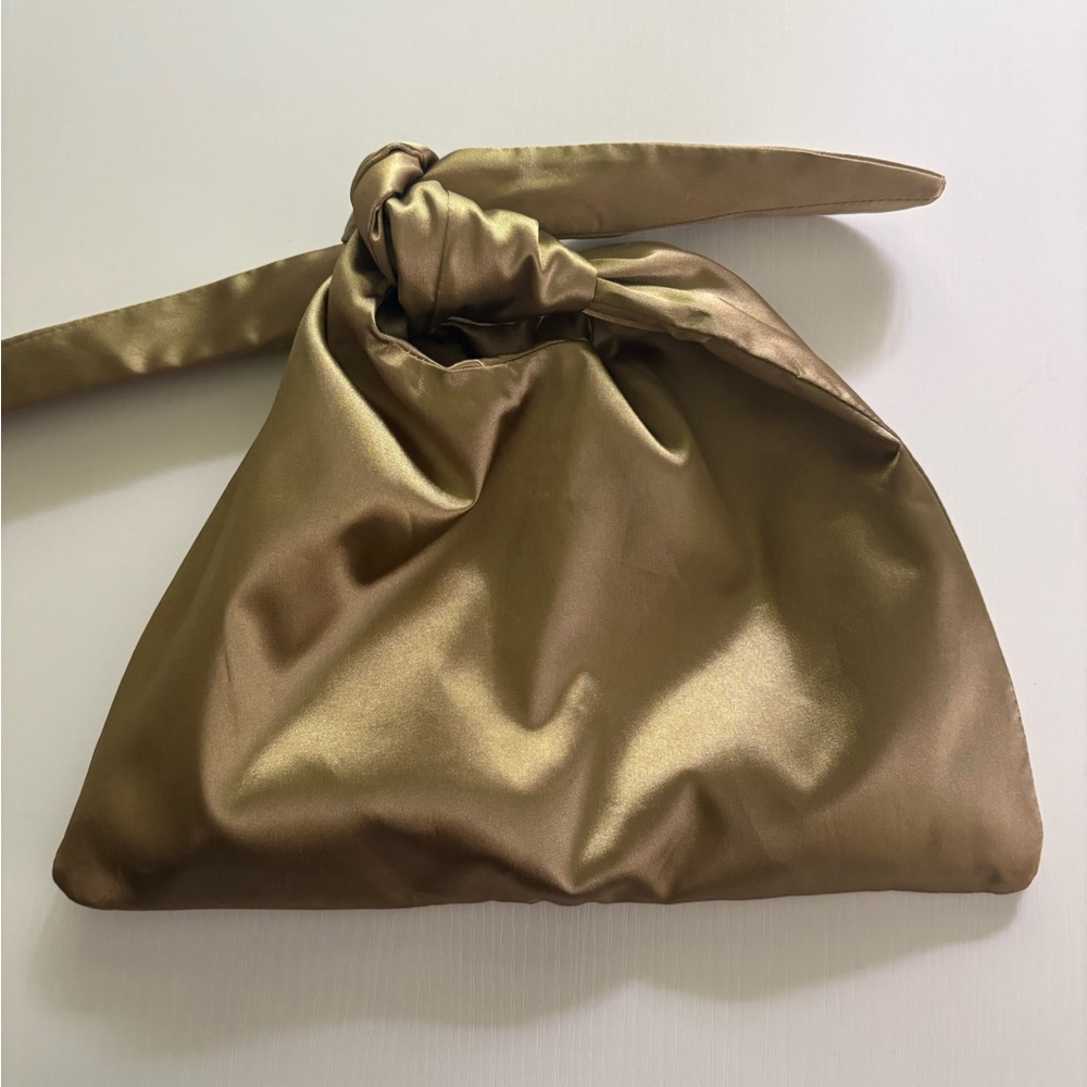 Limited edition Tove Merit Beauty Knot-Top Cosmetic Pouch in Gold